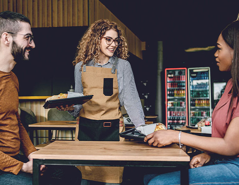 waitress-bringing-food-to-customers-in-a-fast-food-restaurant-carousel